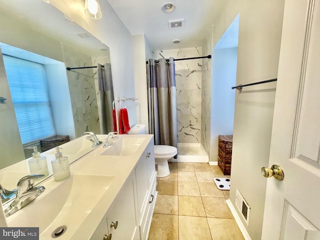 bathroom featuring a shower stall, tile patterned floors, double vanity, and toilet