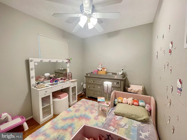 bedroom featuring ceiling fan and wood finished floors