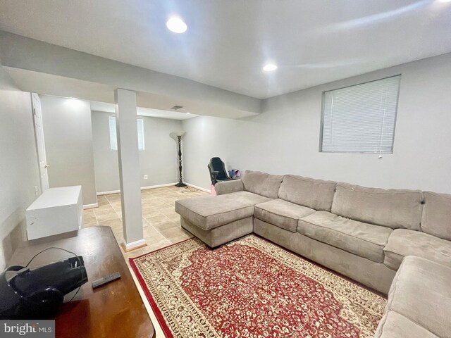 living room featuring recessed lighting and baseboards