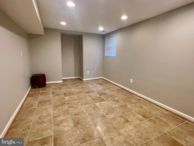 below grade area featuring recessed lighting and baseboards