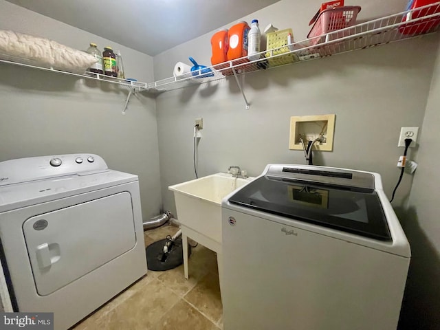 washroom with washer and dryer