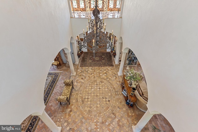 13320 Signal Tree, Potomac, MD 20854 - entryway featuring arched walkways, a towering ceiling, and a chandelier
