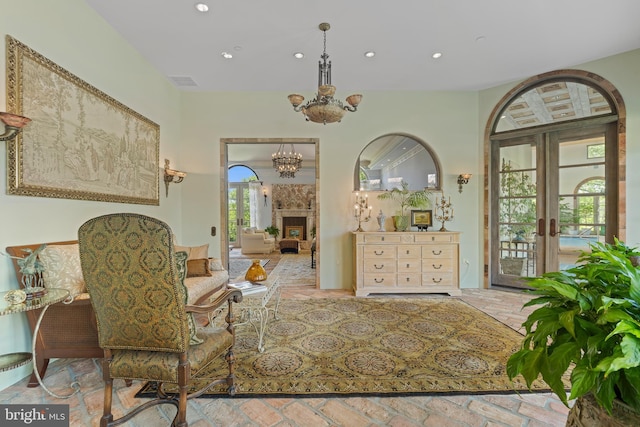 13320 Signal Tree, Potomac, MD 20854 - sitting room with a chandelier, recessed lighting, a fireplace, and french doors