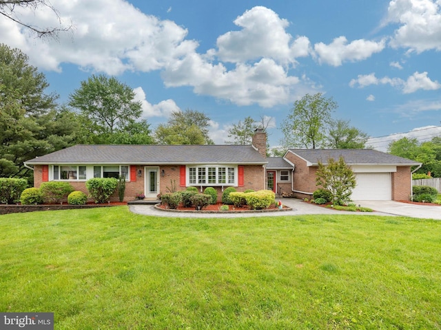 ranch-style house featuring driveway, a chimney, brick siding, and a garage