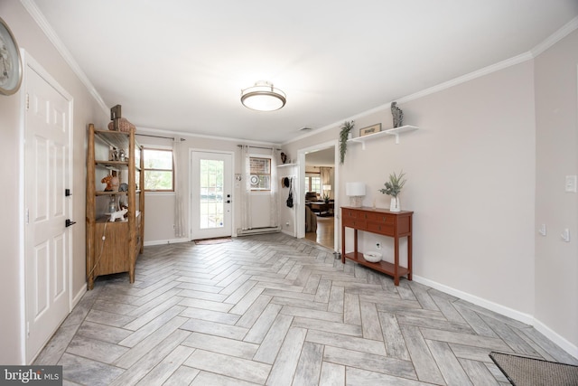 entryway with baseboards and ornamental molding