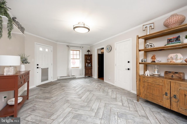 foyer with baseboard heating, ornamental molding, and baseboards