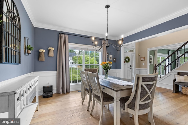 4 Saint Vincent Ct, Stafford, VA 22556 - dining space featuring ornamental molding, a wainscoted wall, stairs, hardwood / wood-style floors, and a chandelier