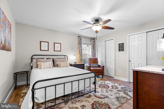 4 Saint Vincent Ct, Stafford, VA 22556 - bedroom with two closets, wood finished floors, baseboards, and a ceiling fan
