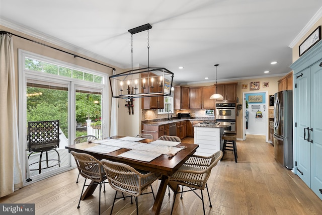 4 Saint Vincent Ct, Stafford, VA 22556 - dining space featuring crown molding, plenty of natural light, light wood-style floors, recessed lighting, and a chandelier