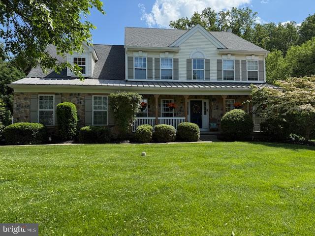 1525 Pownal Dr, Yardley, PA 19067 - colonial home with stone siding, covered porch, and a front yard