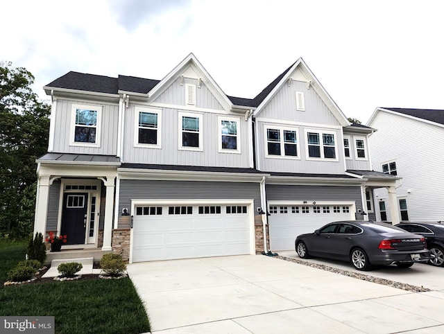 428 Waters Landing Dr, Essex, MD 21221 - view of front of property with an attached garage, driveway, board and batten siding, and stone siding