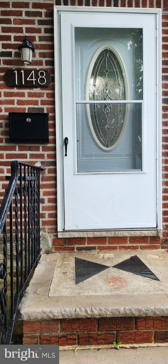 1148 Slocum St, Philadelphia, PA 19150 - view of exterior entry featuring brick siding