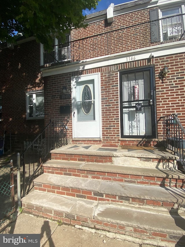 1148 Slocum St, Philadelphia, PA 19150 - doorway to property featuring brick siding