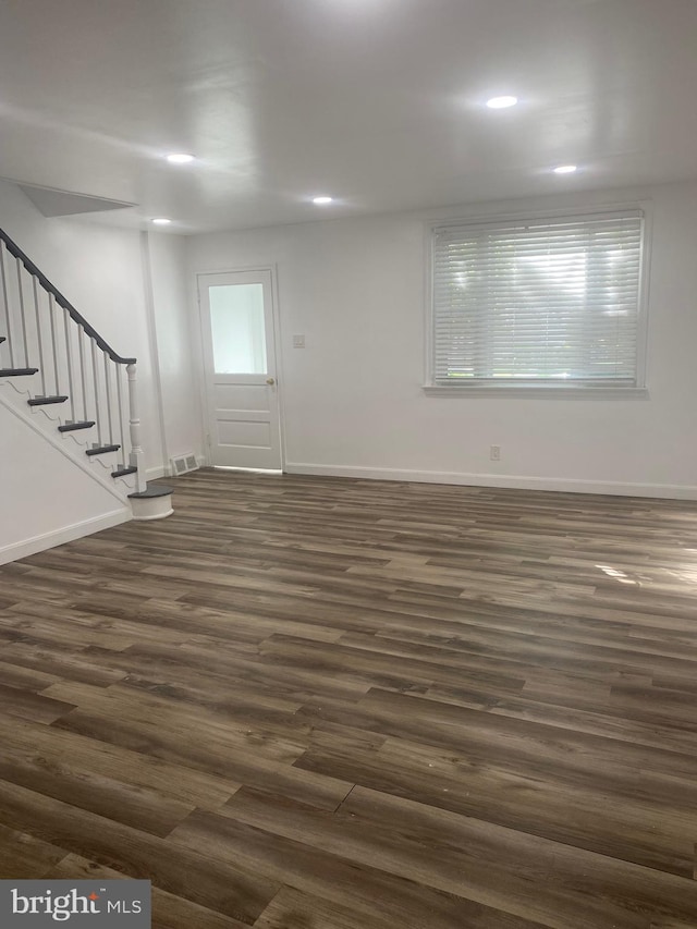 1148 Slocum St, Philadelphia, PA 19150 - unfurnished living room featuring dark wood-style floors, stairs, baseboards, and recessed lighting
