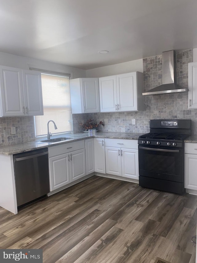 1148 Slocum St, Philadelphia, PA 19150 - kitchen featuring black gas range, wall chimney range hood, stainless steel dishwasher, a sink, and backsplash