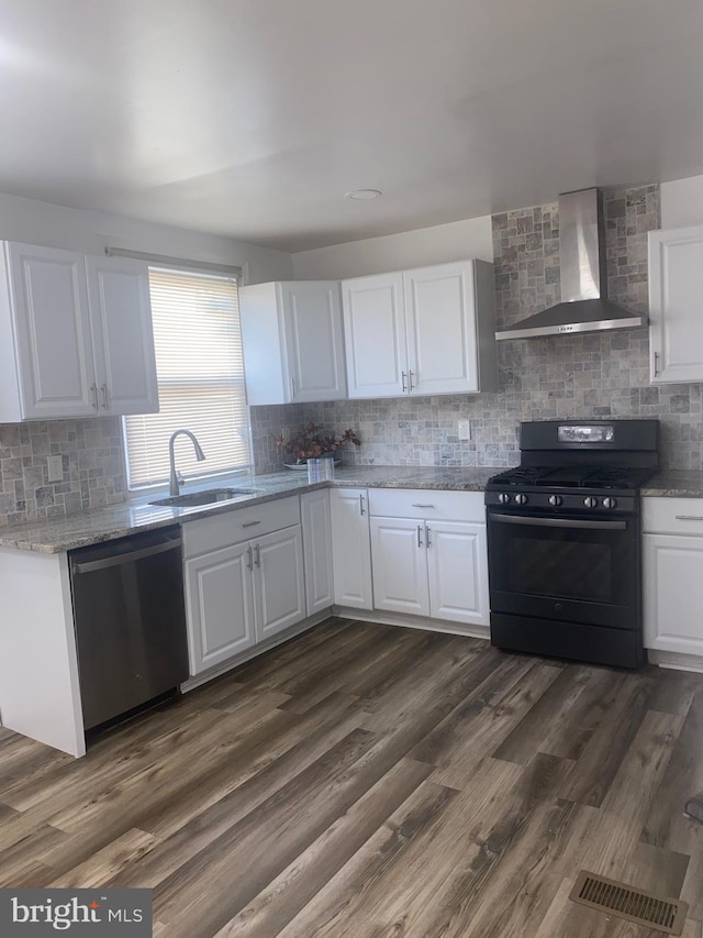 1148 Slocum St, Philadelphia, PA 19150 - kitchen featuring wall chimney exhaust hood, stainless steel dishwasher, black gas range, a sink, and decorative backsplash