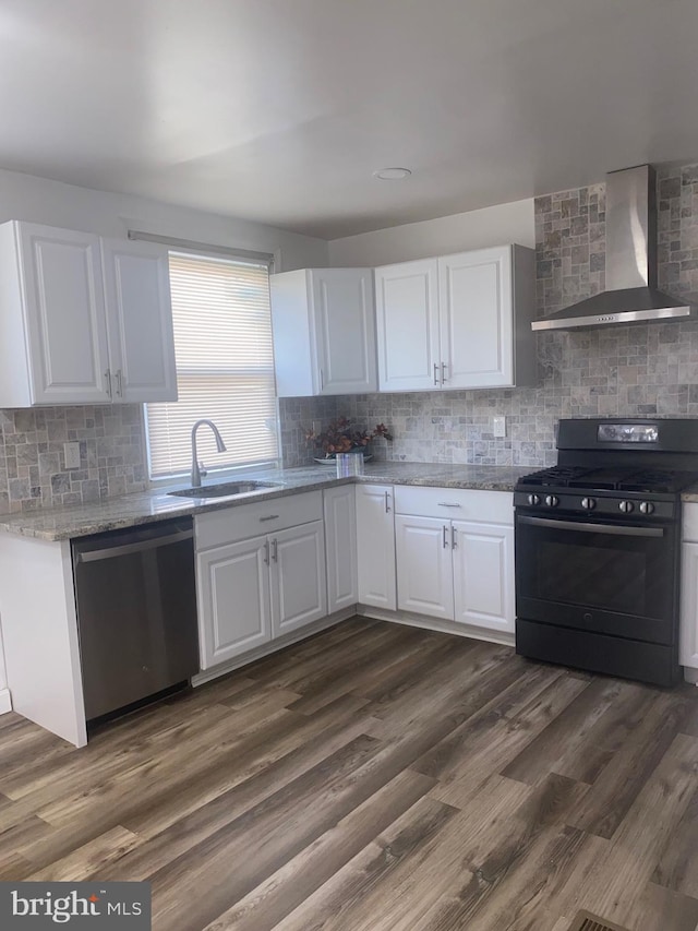 1148 Slocum St, Philadelphia, PA 19150 - kitchen with black gas range oven, stainless steel dishwasher, wall chimney range hood, a sink, and decorative backsplash