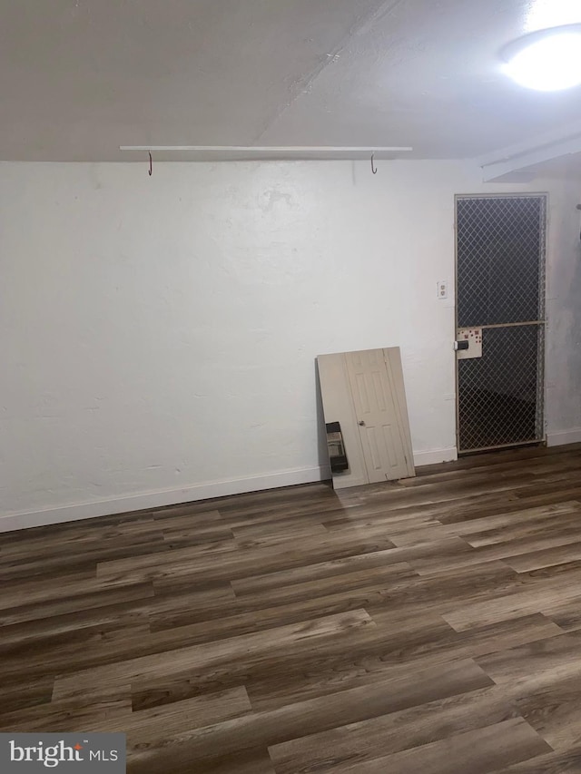 1148 Slocum St, Philadelphia, PA 19150 - spare room featuring dark wood-style flooring and baseboards