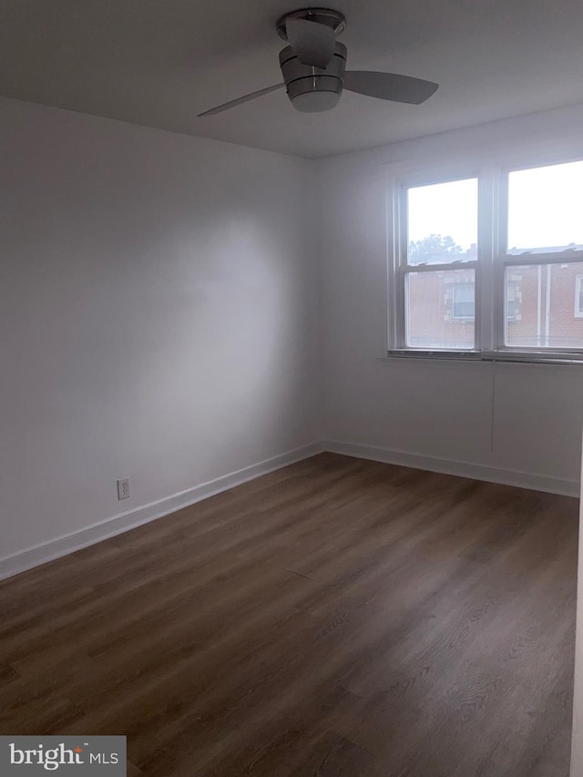 1148 Slocum St, Philadelphia, PA 19150 - unfurnished room featuring dark wood finished floors, a ceiling fan, and baseboards
