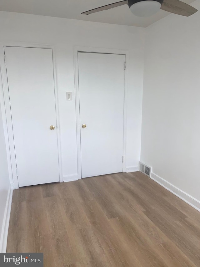 1148 Slocum St, Philadelphia, PA 19150 - unfurnished bedroom featuring wood finished floors, baseboards, and ceiling fan