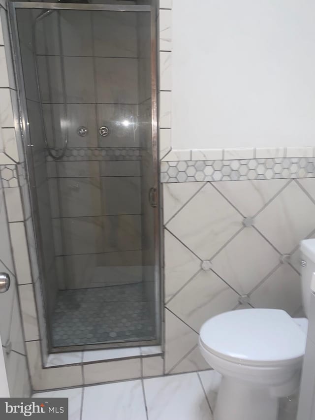 1148 Slocum St, Philadelphia, PA 19150 - full bath featuring tile walls, a shower stall, and toilet