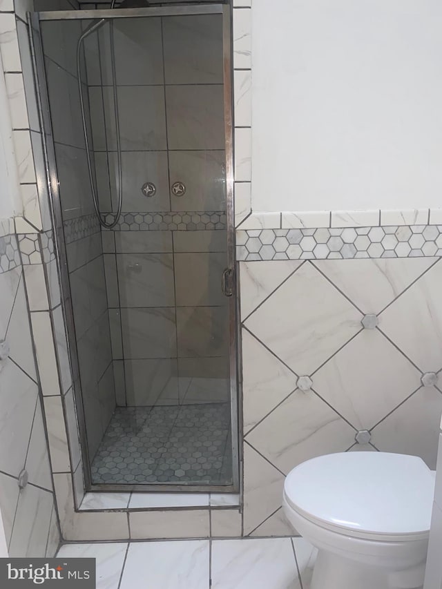 1148 Slocum St, Philadelphia, PA 19150 - full bath featuring a stall shower, tile walls, and toilet