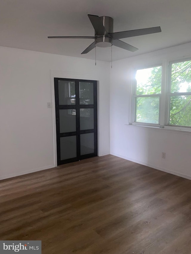 1148 Slocum St, Philadelphia, PA 19150 - unfurnished room with dark wood finished floors, ceiling fan, and baseboards
