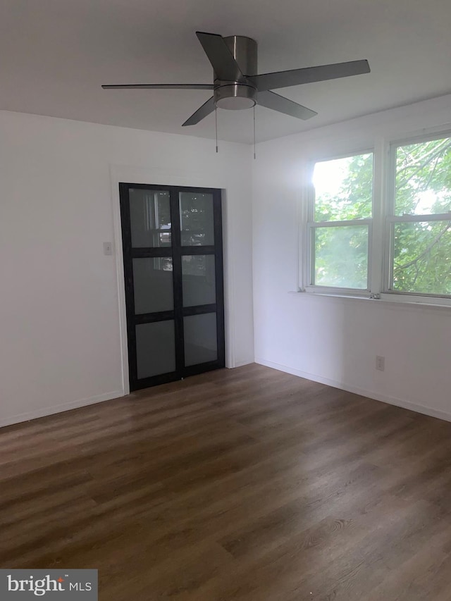 1148 Slocum St, Philadelphia, PA 19150 - empty room with wood finished floors, a ceiling fan, and baseboards