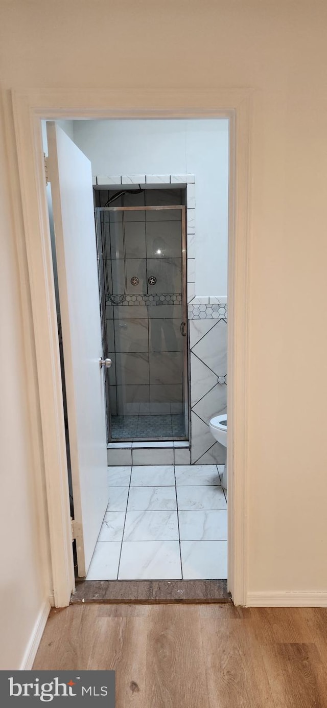 1148 Slocum St, Philadelphia, PA 19150 - bathroom with toilet, wood finished floors, and baseboards