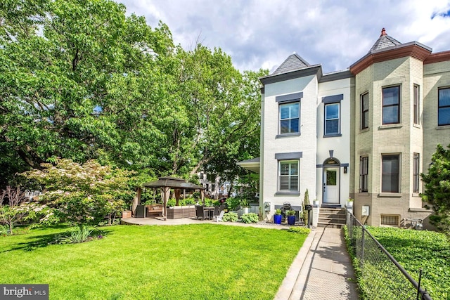 1387 N Carolina Ave NE, Washington, DC 20002 - view of front of property featuring outdoor lounge area, a gazebo, entry steps, and brick siding