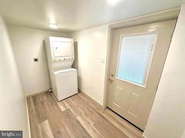118 Hopewell St, Birdsboro, PA 19508 - washroom with estacked washer and dryer, light wood-style floors, and baseboards