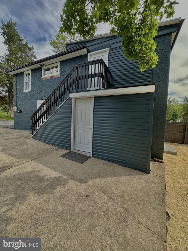 118 Hopewell St, Birdsboro, PA 19508 - back of property featuring stairway and stucco siding
