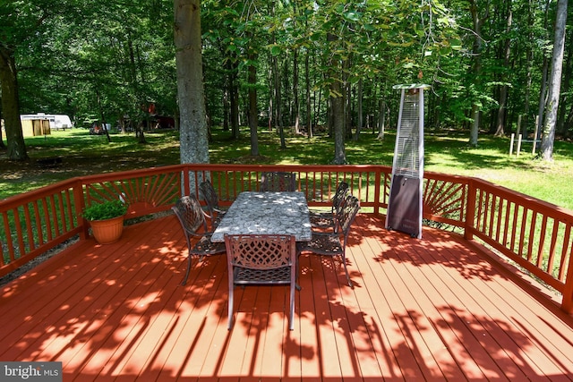 2410 Mill Branch Rd, Bowie, MD 20716 - wooden deck with outdoor dining area and a lawn