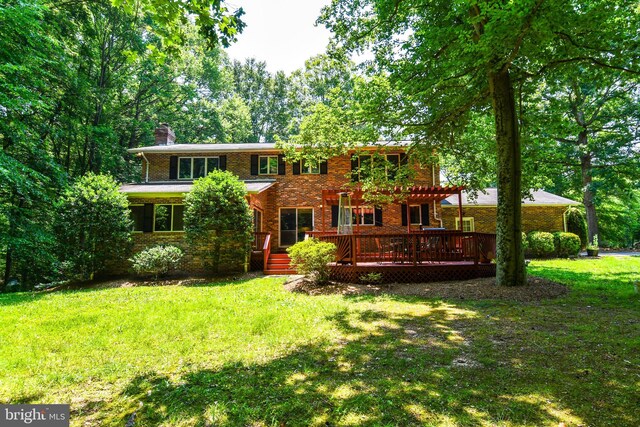 2410 Mill Branch Rd, Bowie, MD 20716 - view of front of property with brick siding, a chimney, a deck, and a front yard