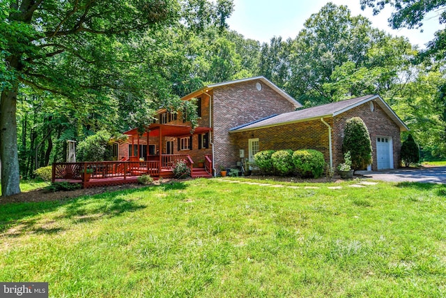 2410 Mill Branch Rd, Bowie, MD 20716 - view of front facade with brick siding, a front yard, a garage, and a wooden deck