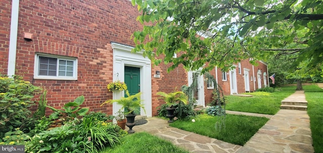 3312 Martha Custis Dr, Alexandria, VA 22302 - doorway to property with brick siding and a yard