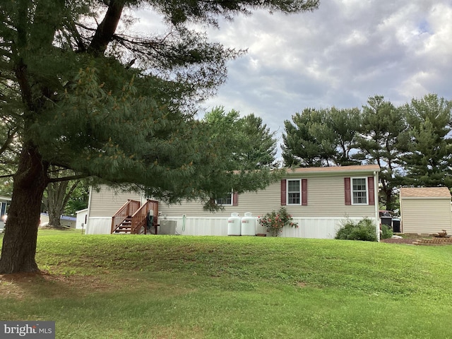 4041 Conowingo Rd, Darlington, MD 21034 - view of side of home with central AC unit and a yard