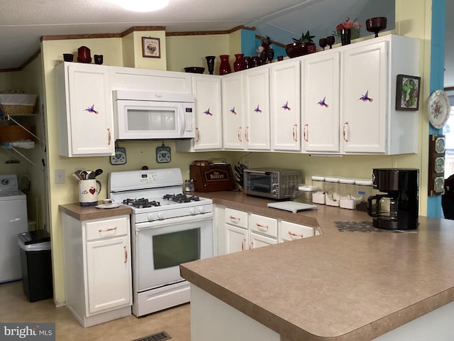 4041 Conowingo Rd, Darlington, MD 21034 - kitchen with white appliances, washer / dryer, white cabinets, a peninsula, and ornamental molding
