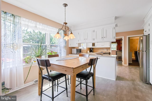 575 Millcross Rd, Lancaster, PA 17601 - dining room featuring baseboards and a chandelier
