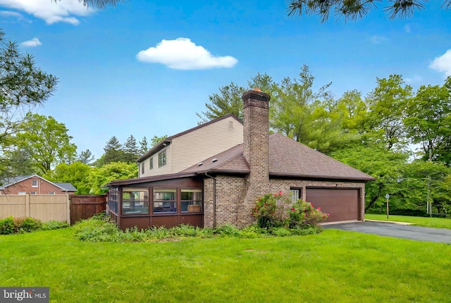 575 Millcross Rd, Lancaster, PA 17601 - view of property exterior featuring a garage, a chimney, driveway, roof with shingles, and brick siding