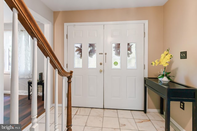 575 Millcross Rd, Lancaster, PA 17601 - foyer entrance featuring stairs, plenty of natural light, light tile patterned floors, and baseboards