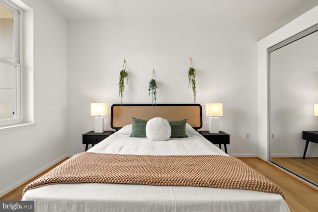 2001 12th St NW Unit 410, Washington, DC 20009 - bedroom featuring wood finished floors, baseboards, and a closet