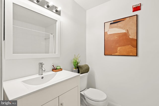 2001 12th St NW Unit 410, Washington, DC 20009 - bathroom featuring toilet, vanity, and baseboards
