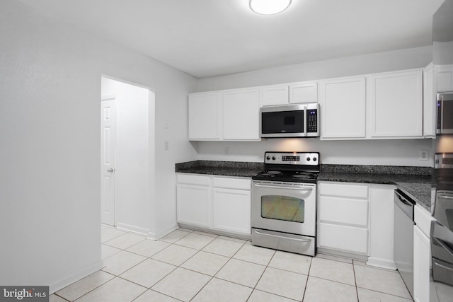 54 Austin Run Blvd, Stafford, VA 22554 - kitchen with appliances with stainless steel finishes, white cabinets, dark countertops, baseboards, and light tile patterned flooring