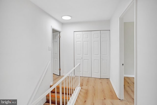 54 Austin Run Blvd, Stafford, VA 22554 - corridor with light wood-style flooring, an upstairs landing, and baseboards