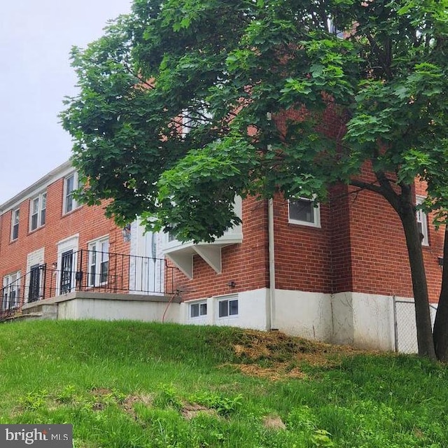 1601 Burnwood Rd, Baltimore, MD 21239 - view of side of home with brick siding