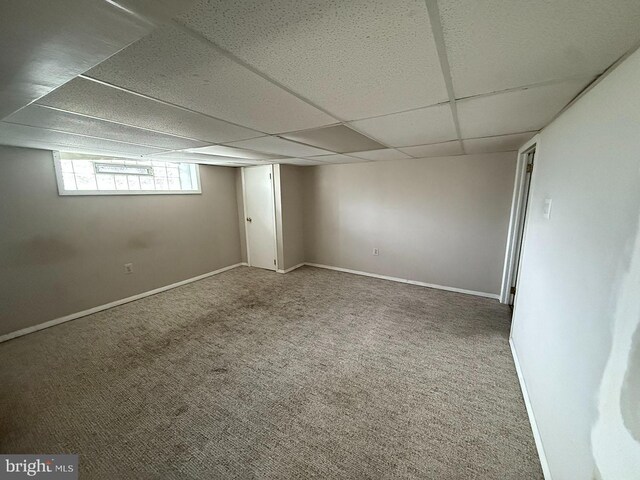 5902 E Roosevelt Blvd, Philadelphia, PA 19149 - basement featuring a paneled ceiling, carpet, and baseboards