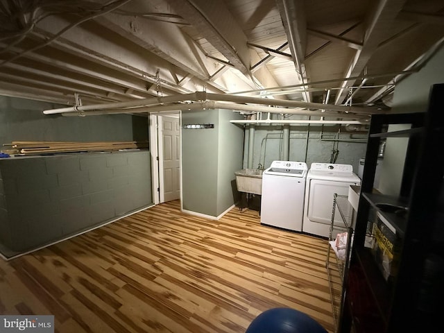 5902 E Roosevelt Blvd, Philadelphia, PA 19149 - finished basement featuring washing machine and clothes dryer, wood finished floors, and a sink