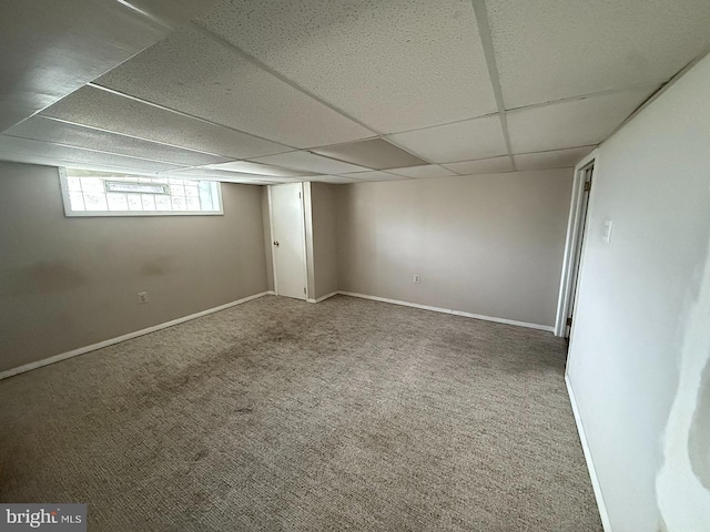5902 E Roosevelt Blvd, Philadelphia, PA 19149 - basement featuring a paneled ceiling, carpet, and baseboards