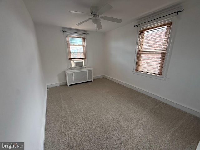 5902 E Roosevelt Blvd, Philadelphia, PA 19149 - spare room featuring radiator, ceiling fan, carpet floors, baseboards, and cooling unit